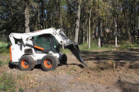 will a skid steer dig|skid steer bucket digging.